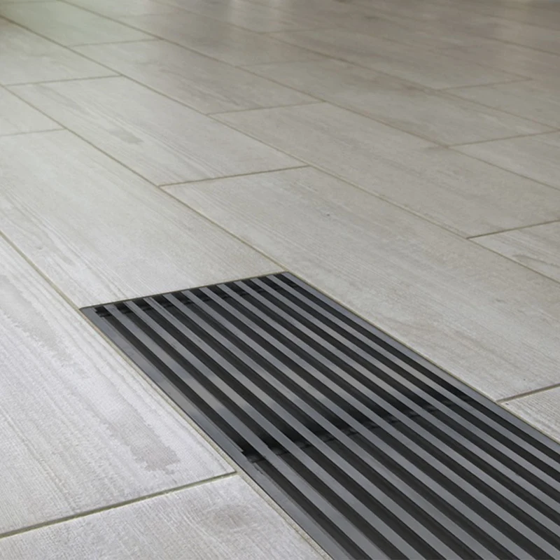 Grille de sol de 300 x 150 mm en aluminium laqué gris RAL9006, avec plénum acier